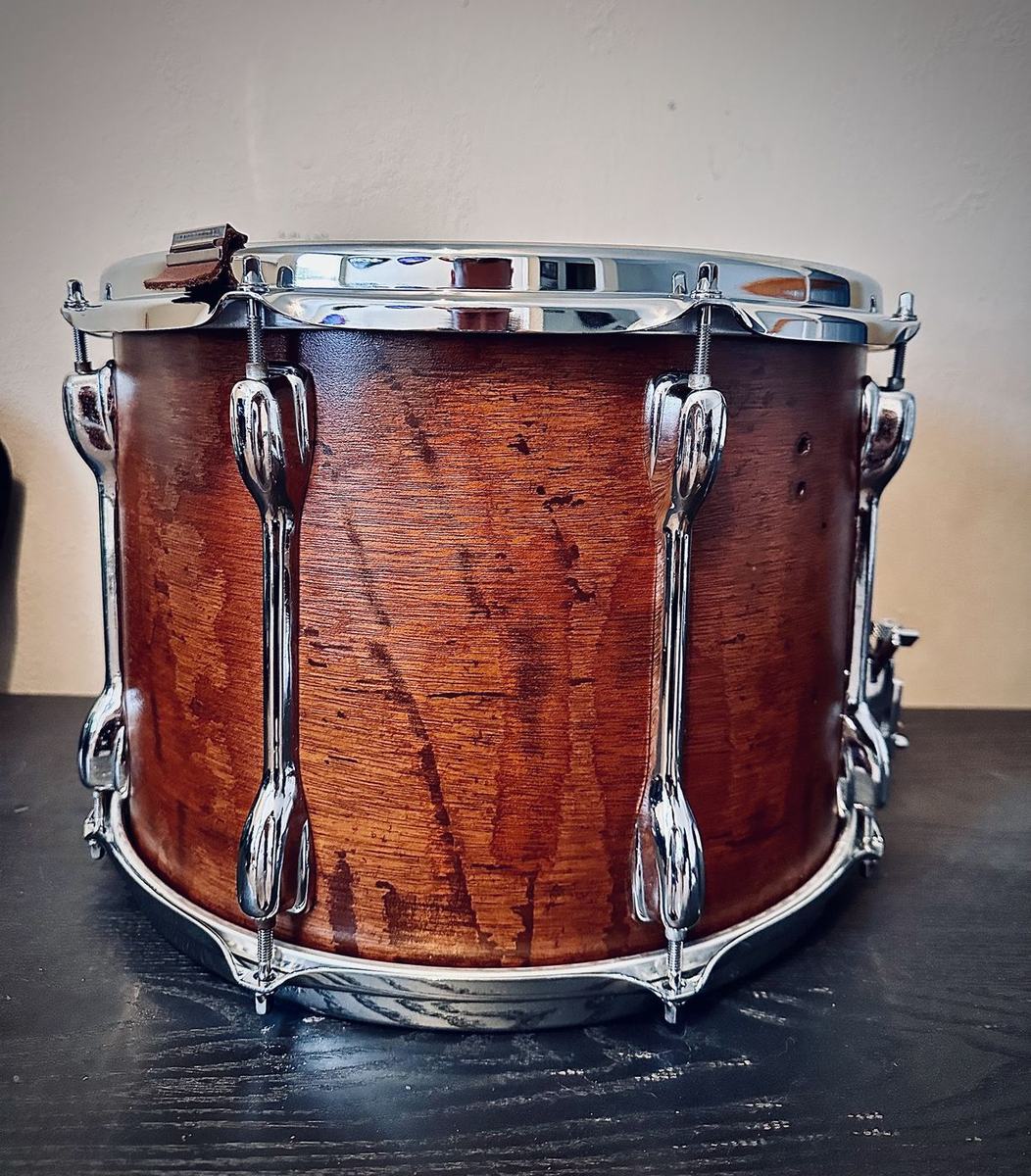 1980s Slingerland marching snare after restoration, grain glowing, hoops and hardware back on