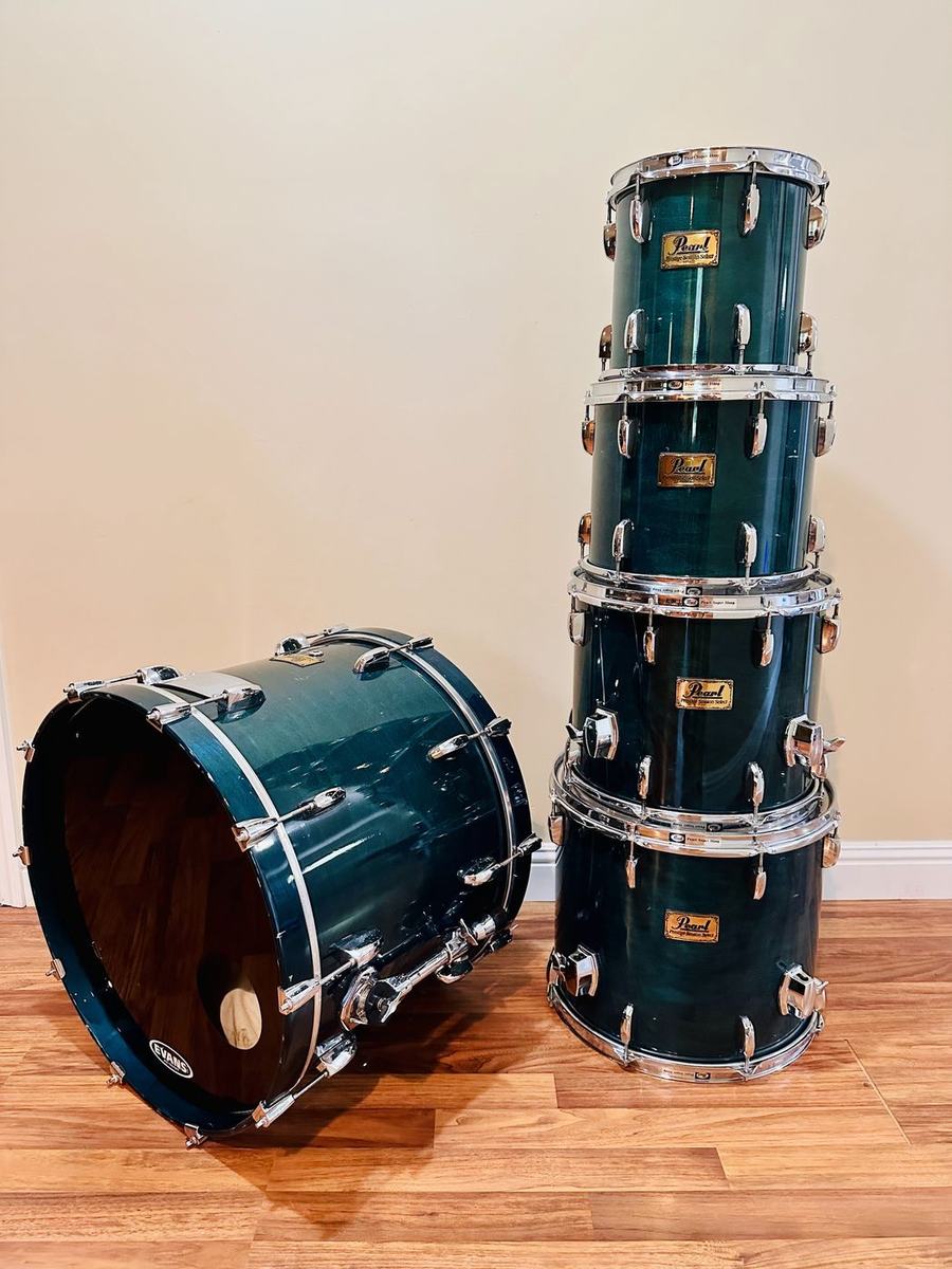 Pearl Prestige Studio Select kit in teal after, shells polished and stacked with the bass drum